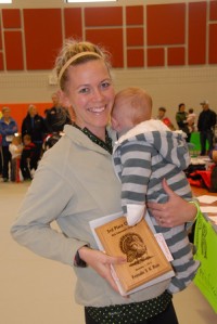 Receiving our super beautiful laser etched wood plaque for 3rd overall.  Baby J is still too good for awards pictures.